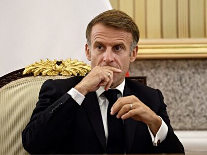 French President Emmanuel Macron attends an agreement-signing ceremony with the Emir of Ku