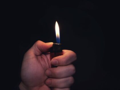 man holding a lighter