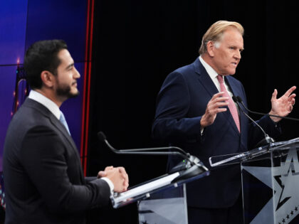 Republican nominee for U.S. Senate Mike Rogers, right, speaks during a televised debate wi