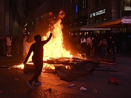 MILAN, ITALY - OCTOBER 17: Protesters clash with police during a demonstration against the