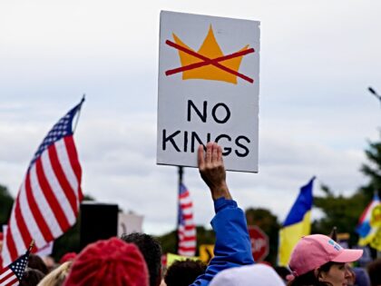 Demonstrators take part in a "No Kings: Vote Early" rally near Memorial Circle in Arlingto
