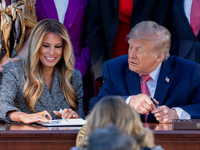 US First Lady Melania Trump, left, and US President Donald Trump during an executive order