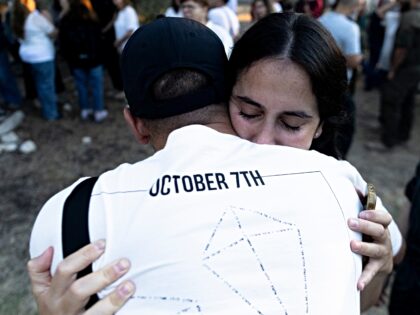 KFAR AZA, ISRAEL - OCTOBER 7: Residents of kibbutz Kfar Aza gather near the Kibbutz armory