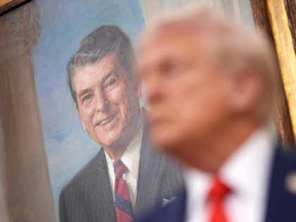WASHINGTON, DC - OCTOBER 10: U.S. President Donald Trump stands beneath a portrait of form