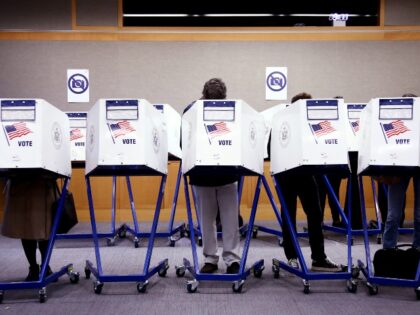TOPSHOT - Voters fill out their ballots at a polling station in New York City on Election