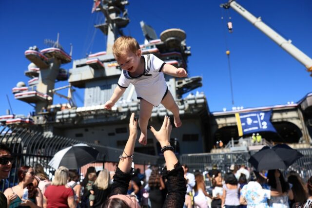 Families welcomed back service members aboard the USS Abraham Lincoln when it returned to
