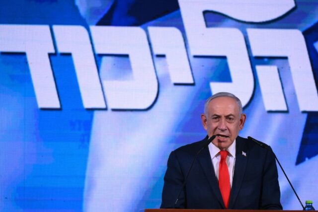 Israel's Prime Minister Benjamin Netanyahu addresses his supporters at an election ni