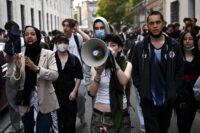 Teenager loses hand picking up grenade in France school protests