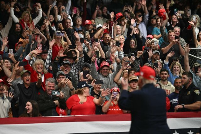 Supporters cheer US President Donald Trump at a rally in Kalispell, Montana, on stop in a