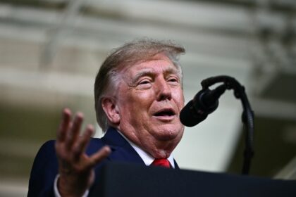 US President Donald Trump delivers remarks at the Peterbilt Motors facility in Denton, Tex