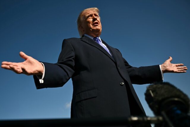 US President Donald Trump speaks to reporters before boarding Air Force One
