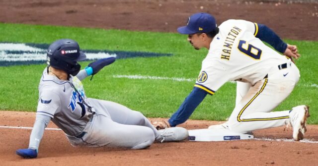 Balls glancing off gloves, runners thrown out trying to steal sink Rays in World Series opener