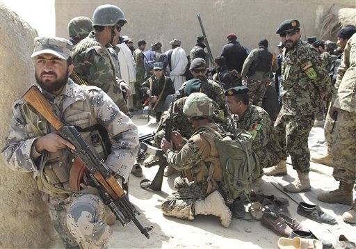 Taliban fire on Afghan officials at attack site