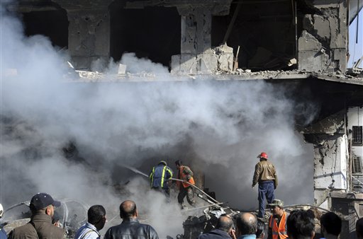 Suicide blasts kill dozens in Syrian capital