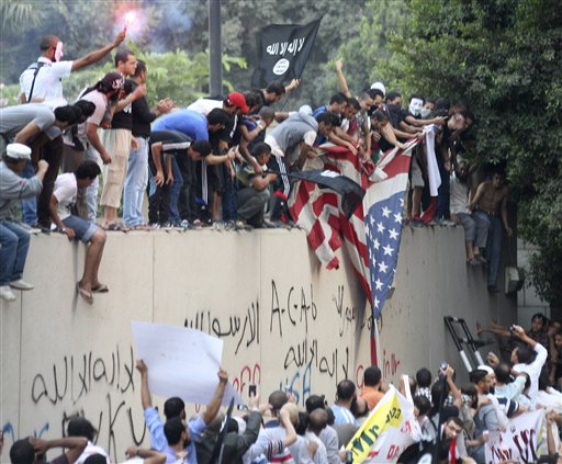 Egyptian protesters scale US Embassy wall in Cairo