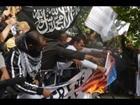 Flags Burned at London Protest Against US