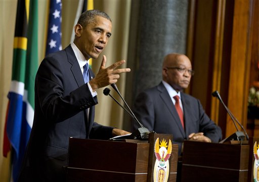 Obama, in South Africa, Tells U.S. Media to 'Behave'
