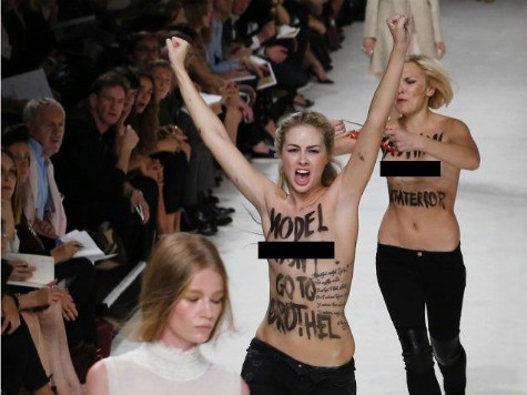 Supermodel Punches Half-Naked Femen Protester in Nose on Catwalk