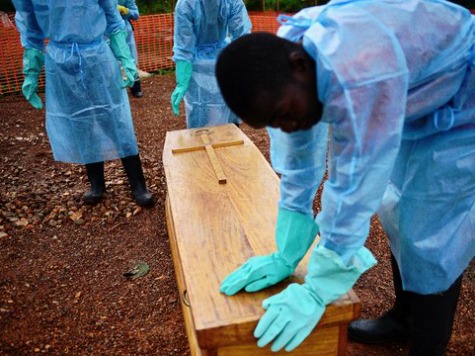 Men Dig Up Coffin of Suspected Ebola Victim, Place on Highway in Protest