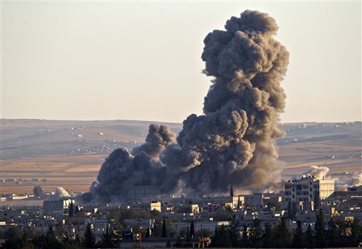 Activists: US-Led Syria Strikes Kill at Least 860