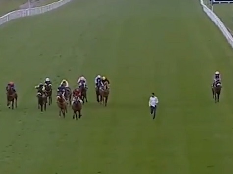 VIDEO: Man Attempts To Outrun Horses In Bizarre Track Stunt