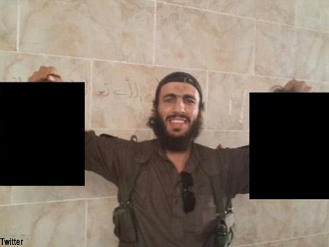 Australian Jihadist Poses with Decapitated Heads