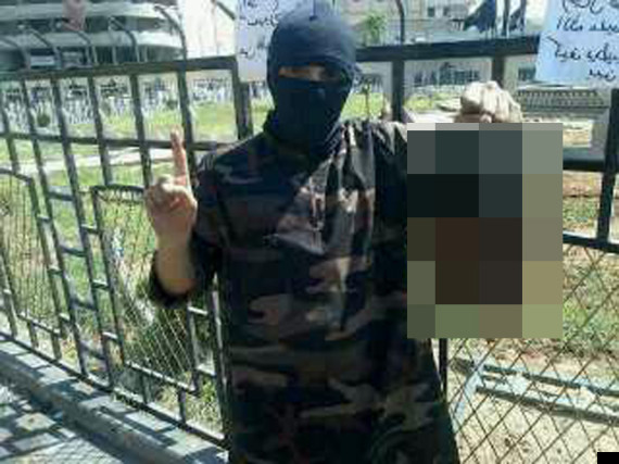 British Rapper Turned Jihadi Poses With Severed Head In Syria