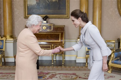 Queen Elizabeth Honors Angelina Jolie at Palace