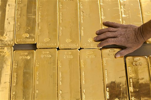 Swiss reject plan to hoard gold, limit immigration