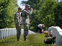 Soldiers Plant Flags At Arlington