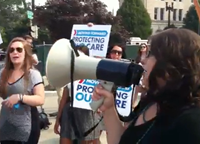 Single Conservative Confronts Protesters Chanting 'We Love Obamacare'