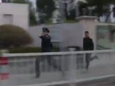 China Security Officers Chase Down CNN Crew Through City Streets