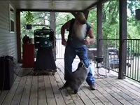 Man Dances With Raccoon