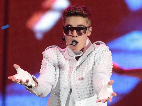 Justin Bieber Asks Crowd to Stop Throwing Things at Him