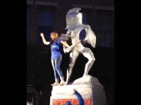 UCLA Fan Gets Pelted with Bottles, Beer After Standing on Tommy Trojan