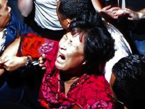 Family Members of Missing Malaysian Flight Passengers Dragged Screaming from Press Conference