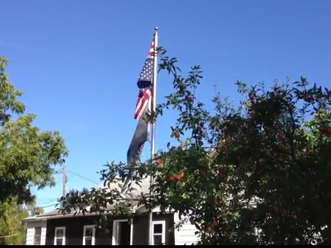 Veteran Flies Flag Upside Down to Protest Government Putting Country in Distress