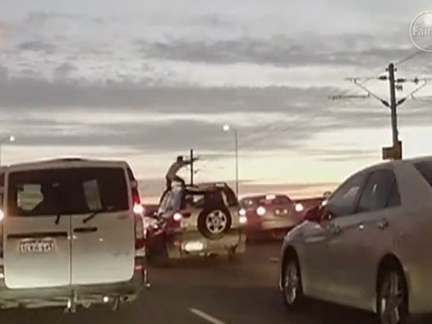 VIDEO: Angry Commuter Headbutts Moving Cars